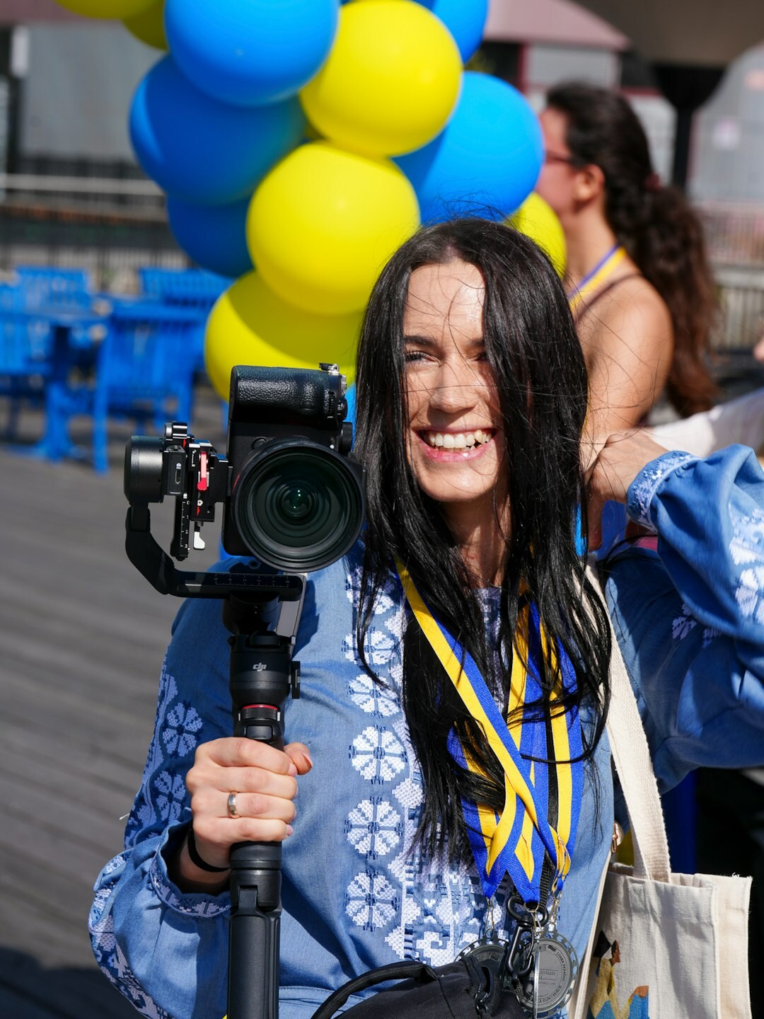 Camera operator filming an interview at a local event
