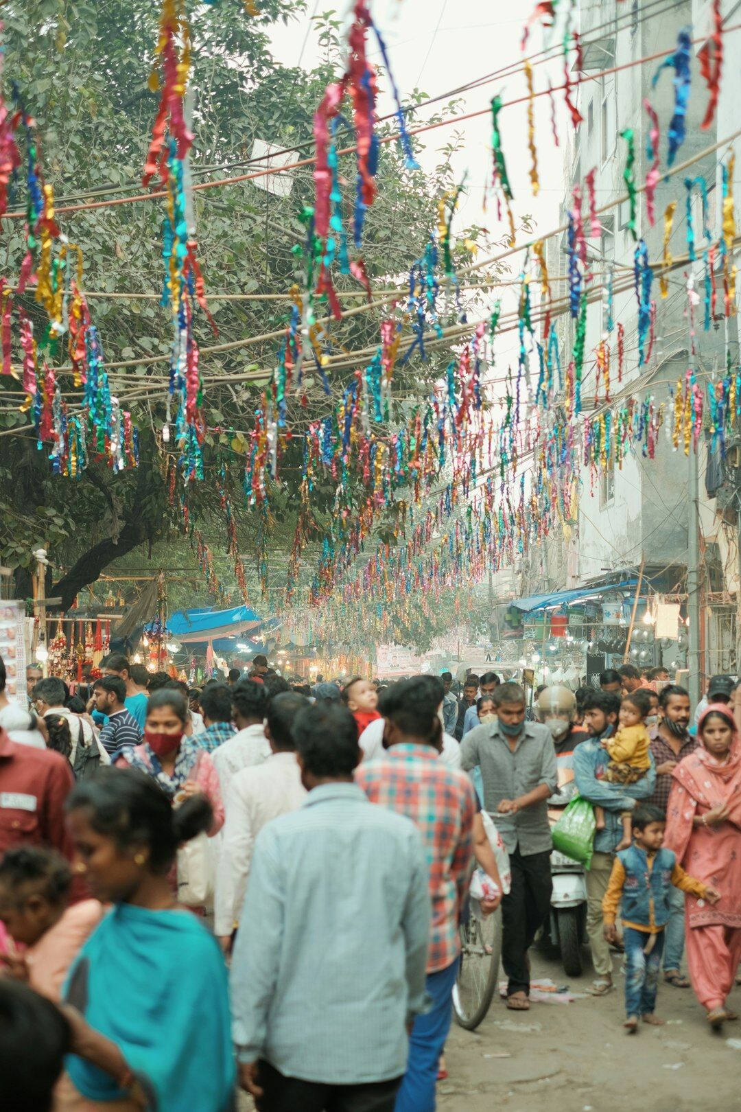 Colorful local festival street decorations and crowd