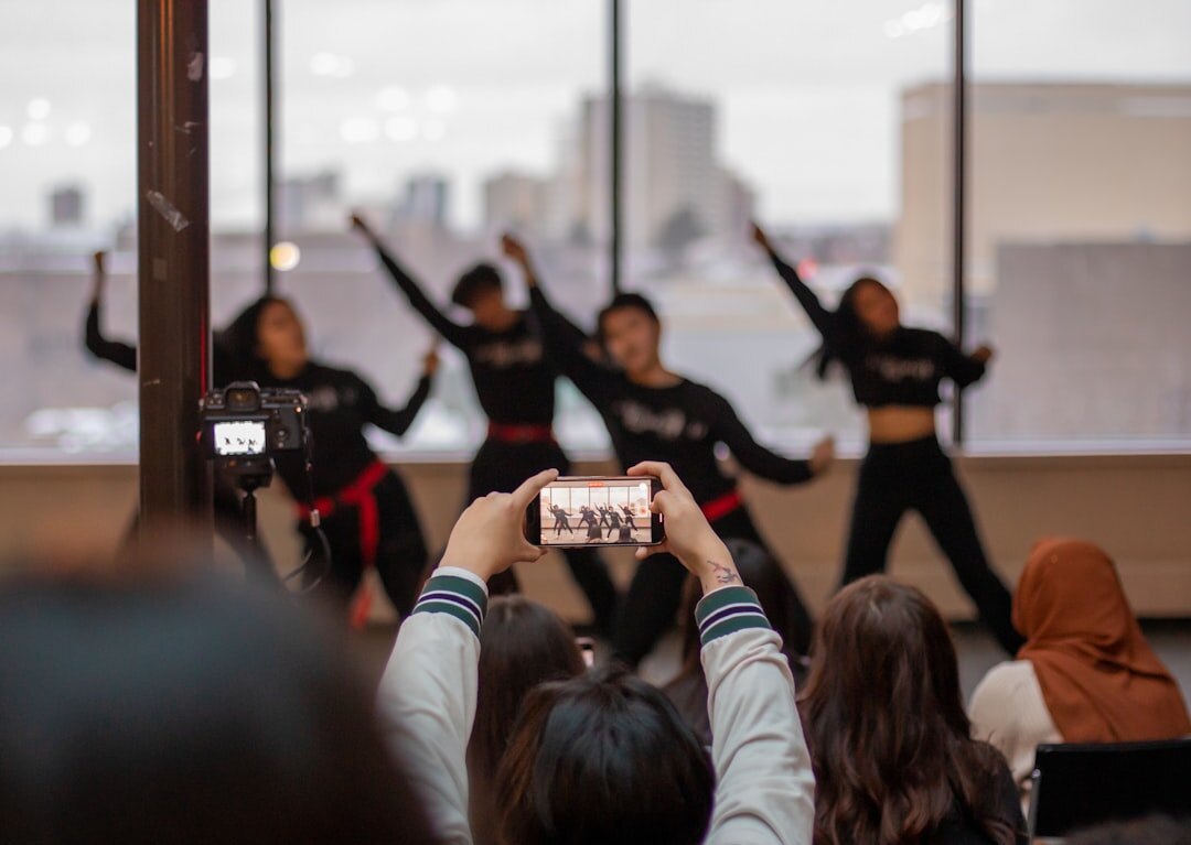Group of trainees practicing camera framing during a workshop