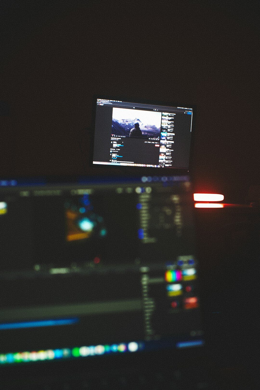 Person editing a short video capsule on a laptop at an event