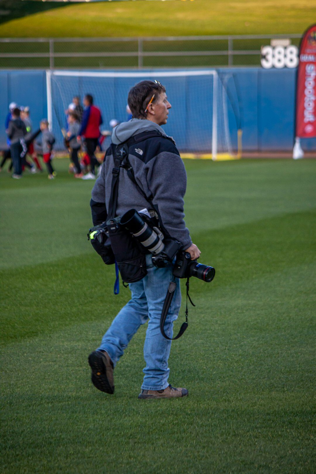 Local amateur sports event being filmed by a camera operator